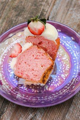 Strawberry Cheesecake Cupcake (strawberry cake w/ cream cheese swirl, crumb base, cream cheese icing, and half a strawberry)