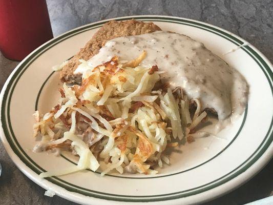 Half of a chicken fried steak order. Still a lot of food.