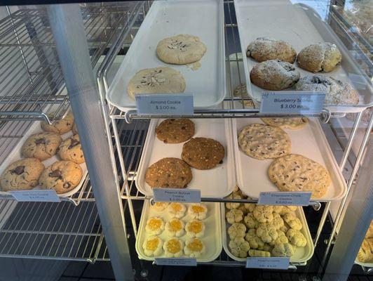 Cookies: New York, almond, blueberry scone, peanut butter, chocolate chip, sugar cookie w/orange marmalade, & pistachio cookie