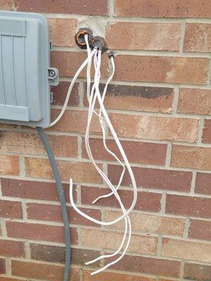 Who needs a wiring box, and why are they running CAT 5 cables onto the side of the house?   We did not pay them to drill through our brick