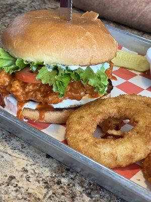 Buffalo chicken sandwich with onion rings