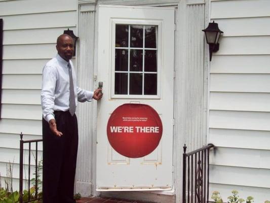 Agent at front door of office