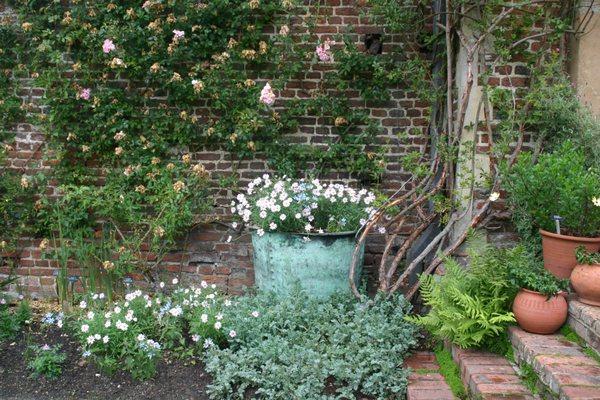 Antique Copper Vat reused as a planter adding a lovely shade of green