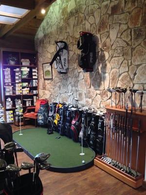 Inside the golf pro shop.  Try out a putter here!