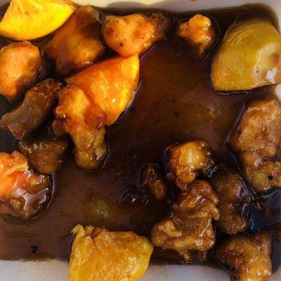 Orange chicken drowning in slimy sauce.