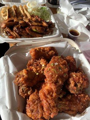 Korean fried chicken with spicy chicken teriyaki combo with gyoza in the back.