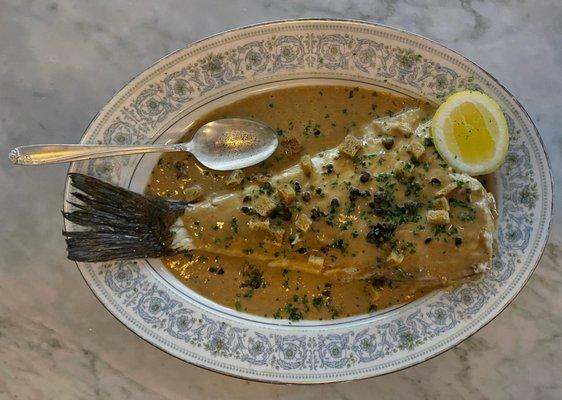 Flounder with a brown butter vinaigrette with capers, croutons, and parsley