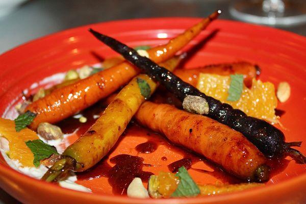 The Oak Ember Roasted Rainbow Carrots was made with Carrot Butterscotch, Crunchy Seeds, Whipped Feta, Citrus, & Torn Mint.