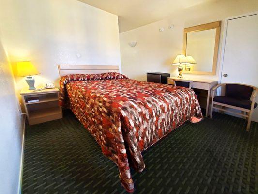 Comfortable queen room offering clean quiet budget friendly options.