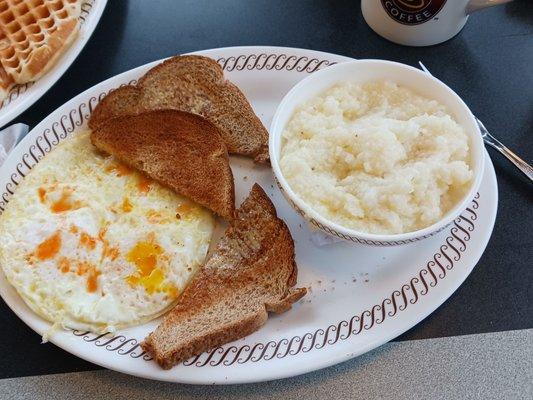 Over easy eggs wheat toast grits