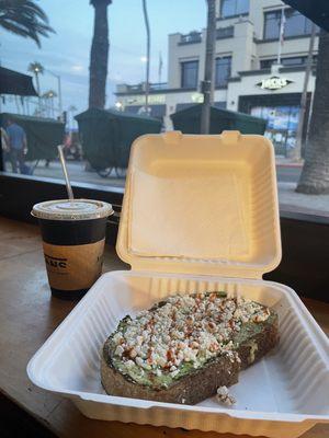 Avocado toast with feta cheese and hot sauce. Washed it down with a refreshing cold nitro coffee. Delicious!