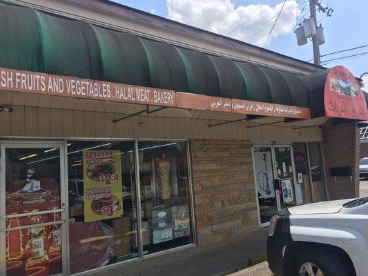 Signs for food on left side of pic (they do a more intense barbecue on weekends).