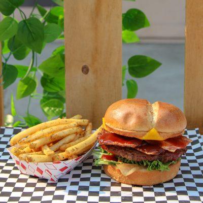 Vegan BBQ Bacon Burger with a side of crispy golden fries!