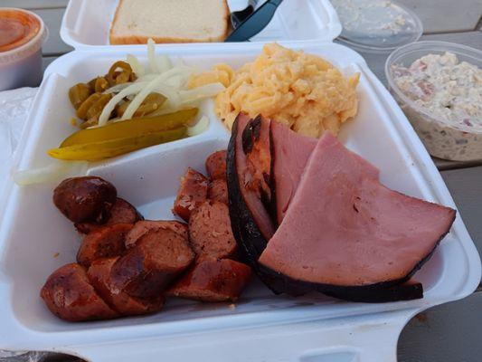 Two-meat ate (smoked ham and sausage with Mac n cheese and potato salad), comes with onions, pickles, and jalapenos