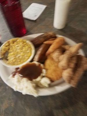 The Big Daddy platter. 5 pieces of fish, 2 big chicken tenders, 5 pieces of fried shrimp, 2 huge potato wedges, corn, and mashed potatoes.