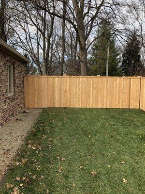 Solid Cedar Privacy Fence with Top Face Trim and Post Caps