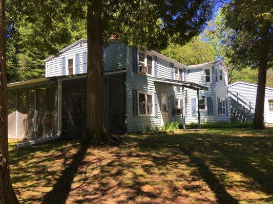 Between Two Lakes sleeps 10 is located across popular Clark Lake in Door County.  Huge screen porch and a dock located across at the lake.