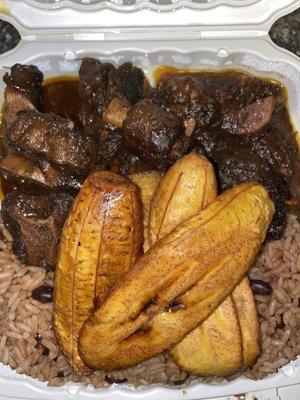 Oxtail, Fried Plantain, Rice & Peas.. Huge portions and great food.