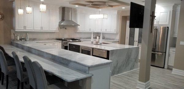 BAR SEATING REALLY ADDS TO THE ELEGANCE OF THIS KITCHEN