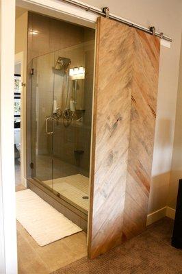 Custom Barn Door Leading to an amazing Walk-in Shower