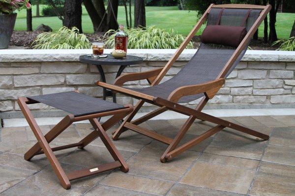 The Sling & Eucalyptus Swing Lounger is made from plantation grown Brazilian Eucalyptus and dark brown long lasting "sling" woven resin.