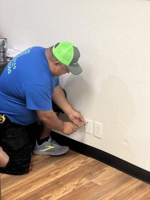 Steve installing new outlet covers.