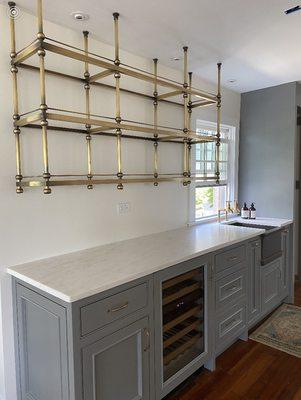 Custom manufactured brass & glass bar shelves.