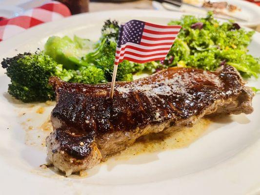 Bison New York Striploin with kale salad and baked Parmesan broccoli