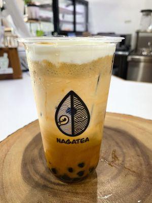 Pandan Caramel Thai Tea with brown sugar boba and salted cream.