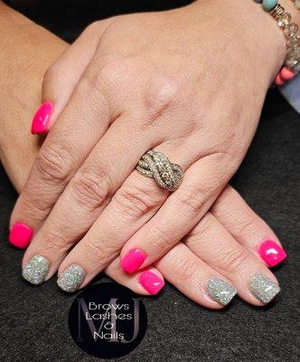 Neon pink dip nails with holographic loose glitter accents!