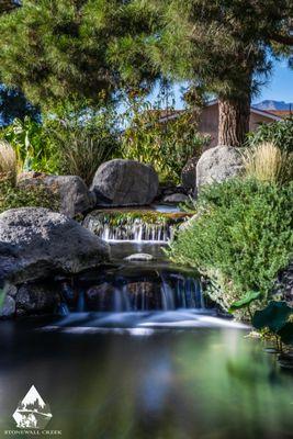 Waterfall addition built as an extension to a natural pond.