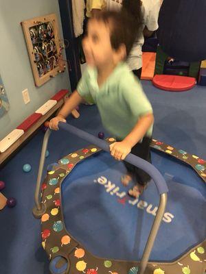 Having fun on the trampoline in the gym.