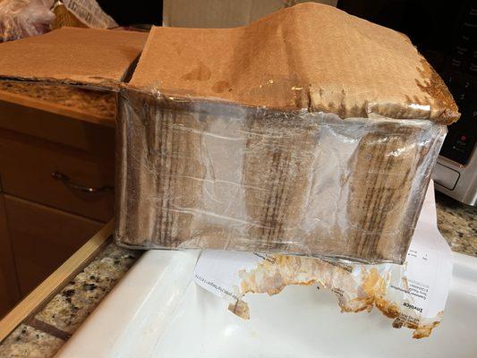 Re-taped damaged box to conceal damage