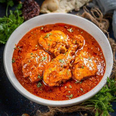 Chicken Vindaloo, in a spicy hot vinegar based sauce.