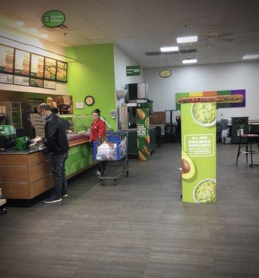 Inside Walmart, Subway provided a spot to sit down while waiting for a tire repair.