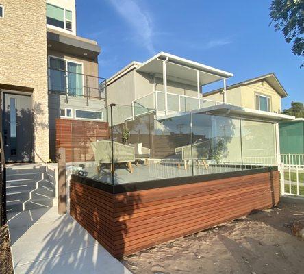 Glass deck railings with a black shoe/base.