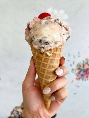 Sweet cream with hot fudge, brownies, and fresh strawberries