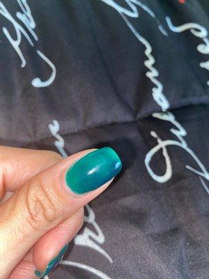 Nail not painted all the way down to the cuticle