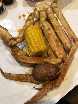 Crabs legs with corn and potato