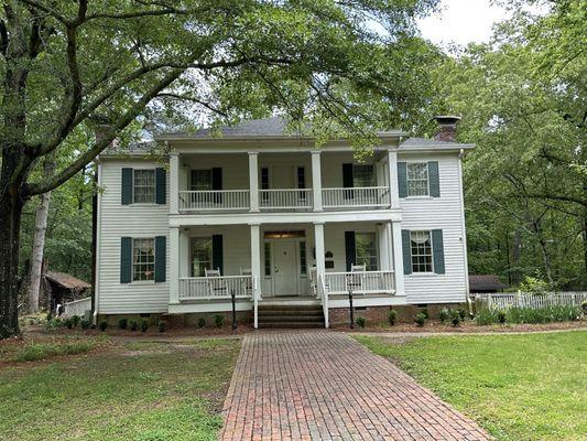 Front of house. Kitchen seen to the left.