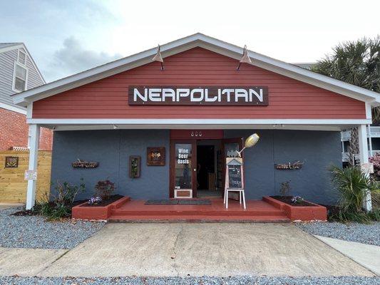 Front of Neapolitan, parking is allowed in the front of the business and house next door