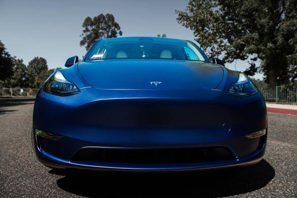 Paint protection film installation on Tesla Model Y. Full front view