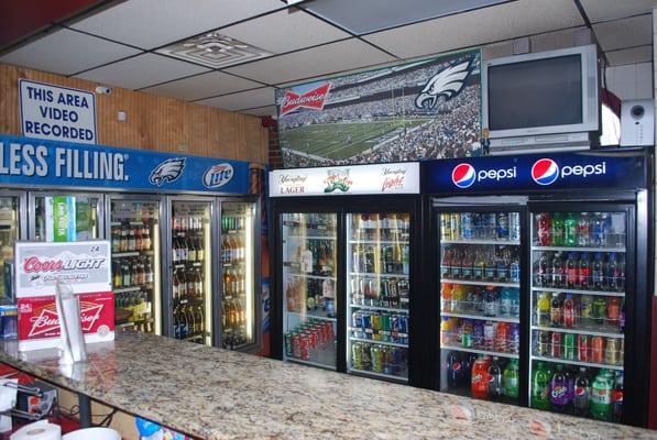 Full selection of soda, juice, and 22 and 40 oz bottles of beer.