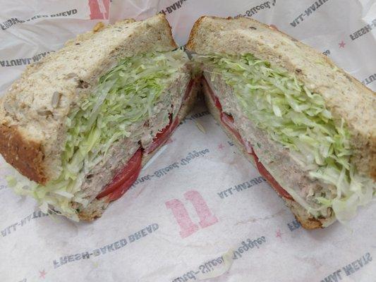 Tuna on wheat with extra lettuce and tomatoes.