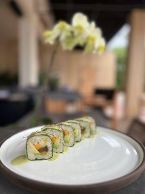 Happa 64 Roll with mango, shiitake, cucumber, takuan radish, and avocado, wrapped in collard greens