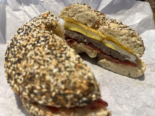 Everything bagel with egg, sausage, bacon, and cheddar.