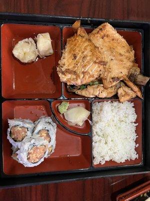 Grilled salmon bento with spicy tuna roll, shumai, white rice and vegetables (underneath salmon)