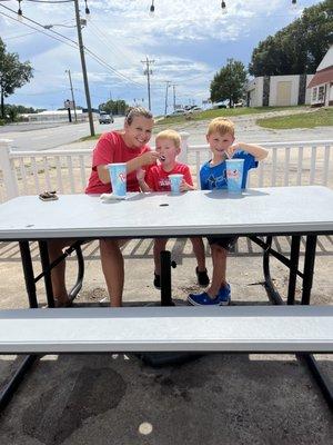 Daughter and grandsons at pelicans snowballs