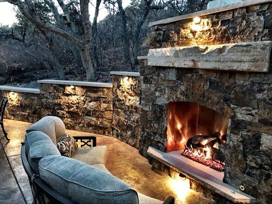 Accent lighting and floor heat for a custom fireplace at a customer's patio in Castle Pines.