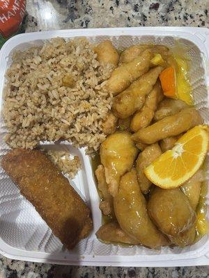 Orange chicken in a thick orange glaze sauce, fried rice, egg roll, soup